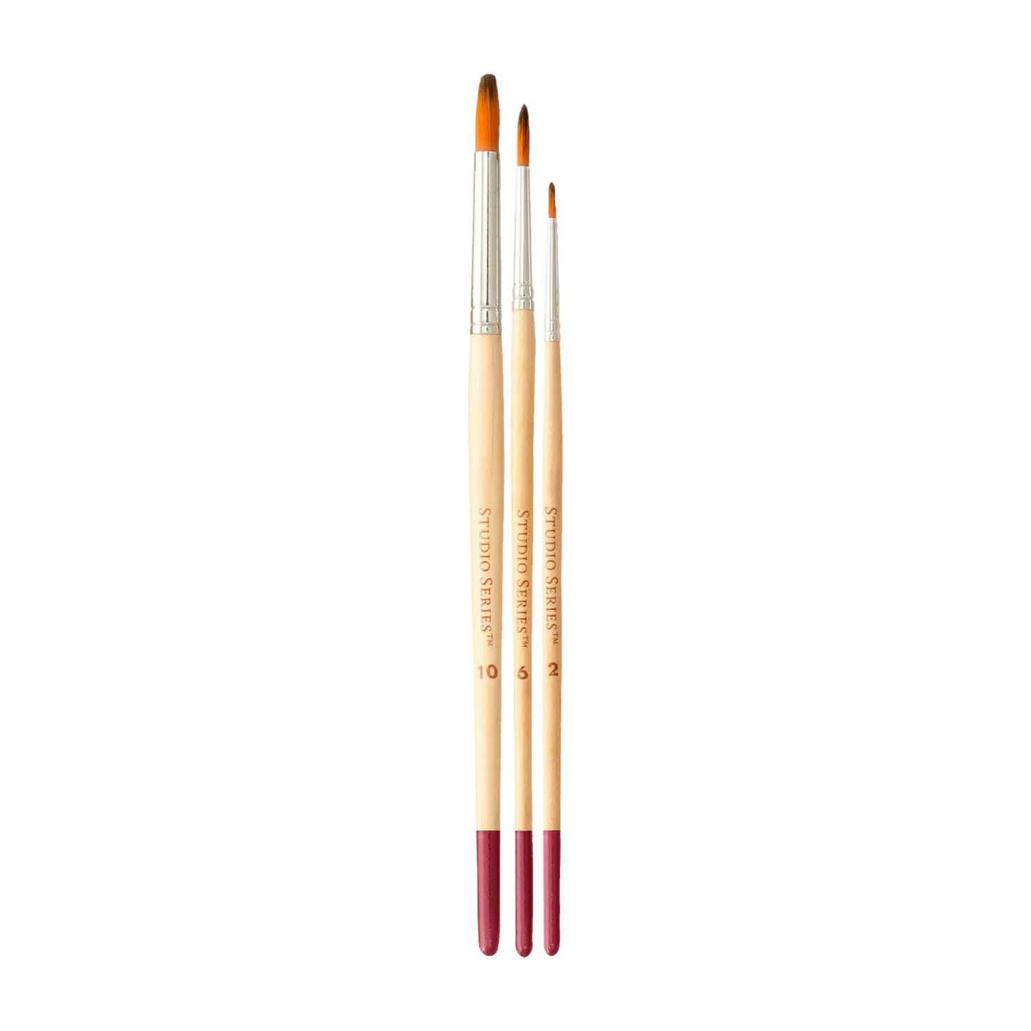 Three paintbrushes with wooden handles and red ferrules on a white background