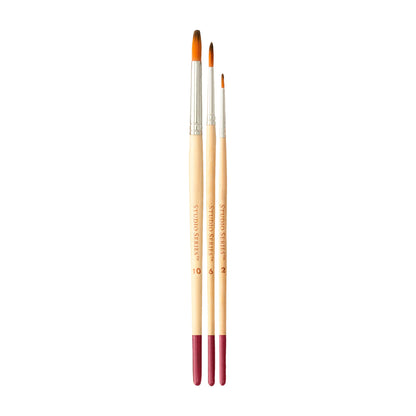 Three paintbrushes with wooden handles and red ferrules on a white background