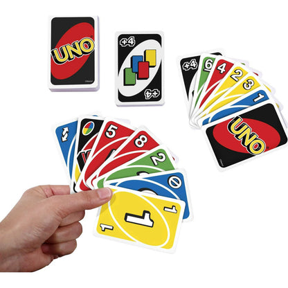 A hand holding UNO playing cards