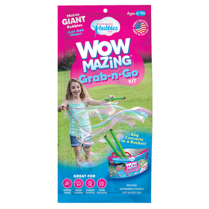 Wow Bubbles Grab-n-Go kit packaging with a girl blowing bubbles on a grassy background