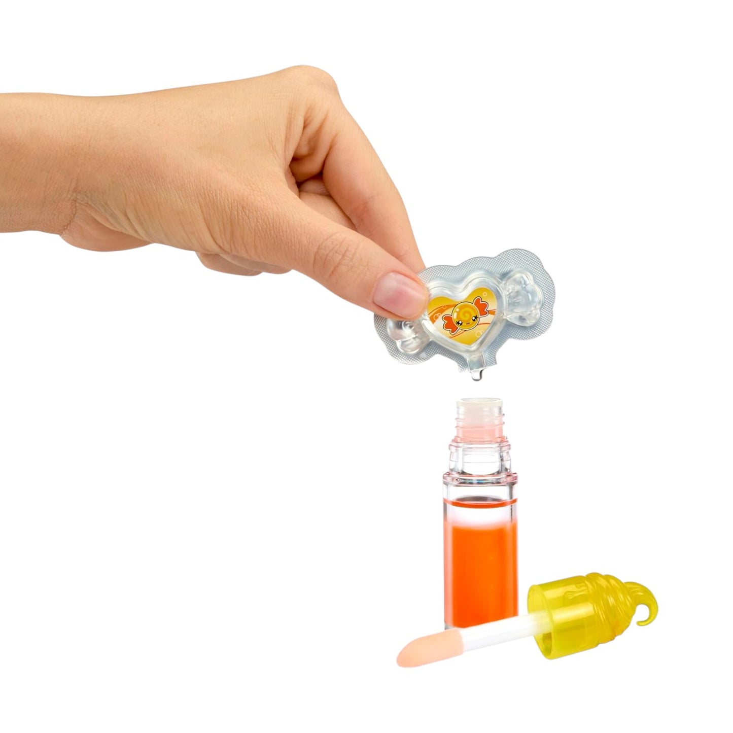 Hand holding a small pacifier with a bottle of orange liquid and a dropper on a white background