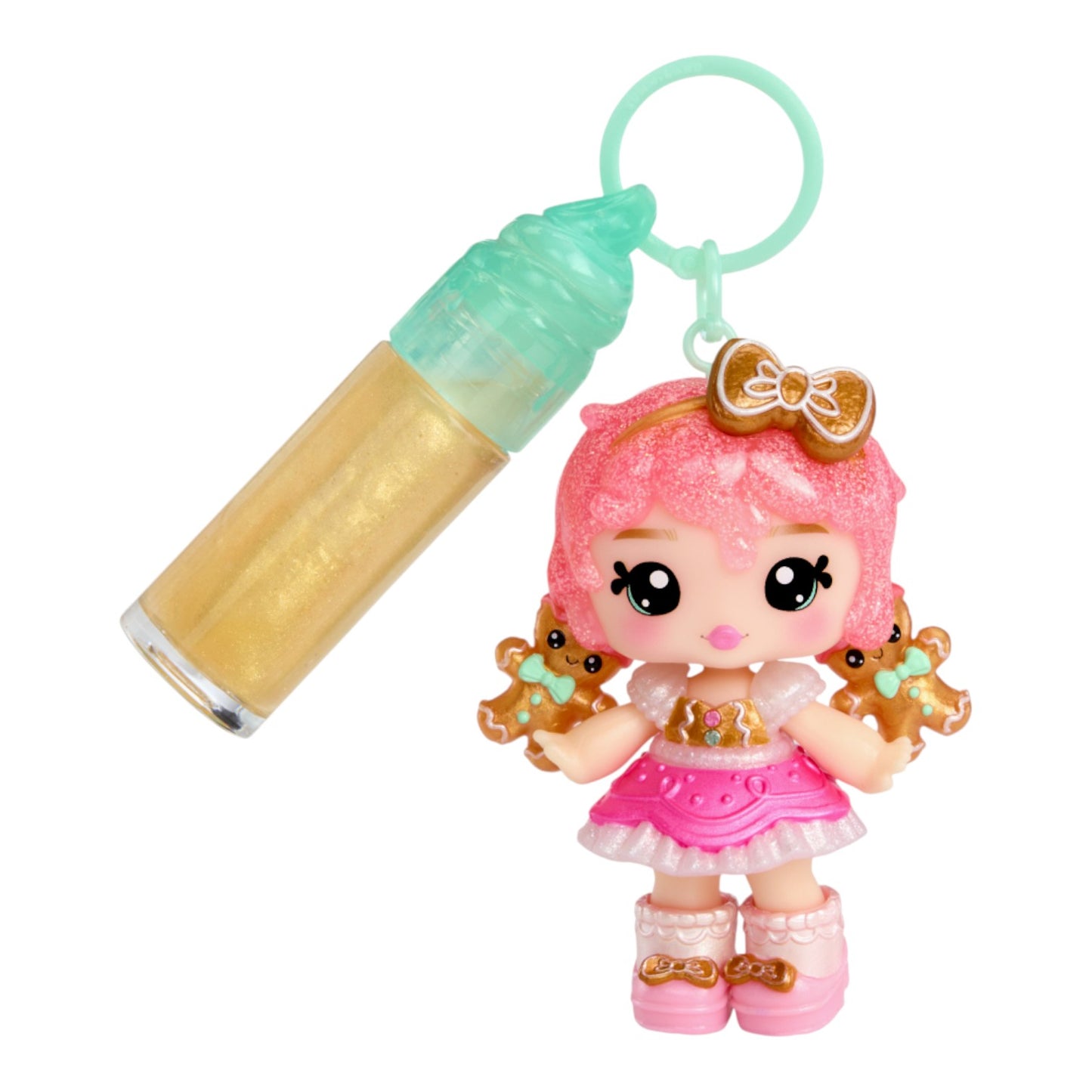 Yummiland Gigi Gingerbread Holiday Lip Gloss Doll with DIY Kit with pink hair and gingerbread theme, holding a bottle-like object on a white background