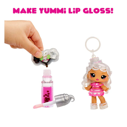 Make Yummi lip gloss set with a small doll and lip gloss bottle on a white background