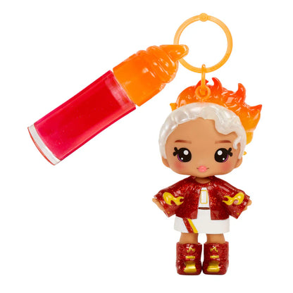 Toy figure with fiery hair and a red and orange outfit, holding a lighter.