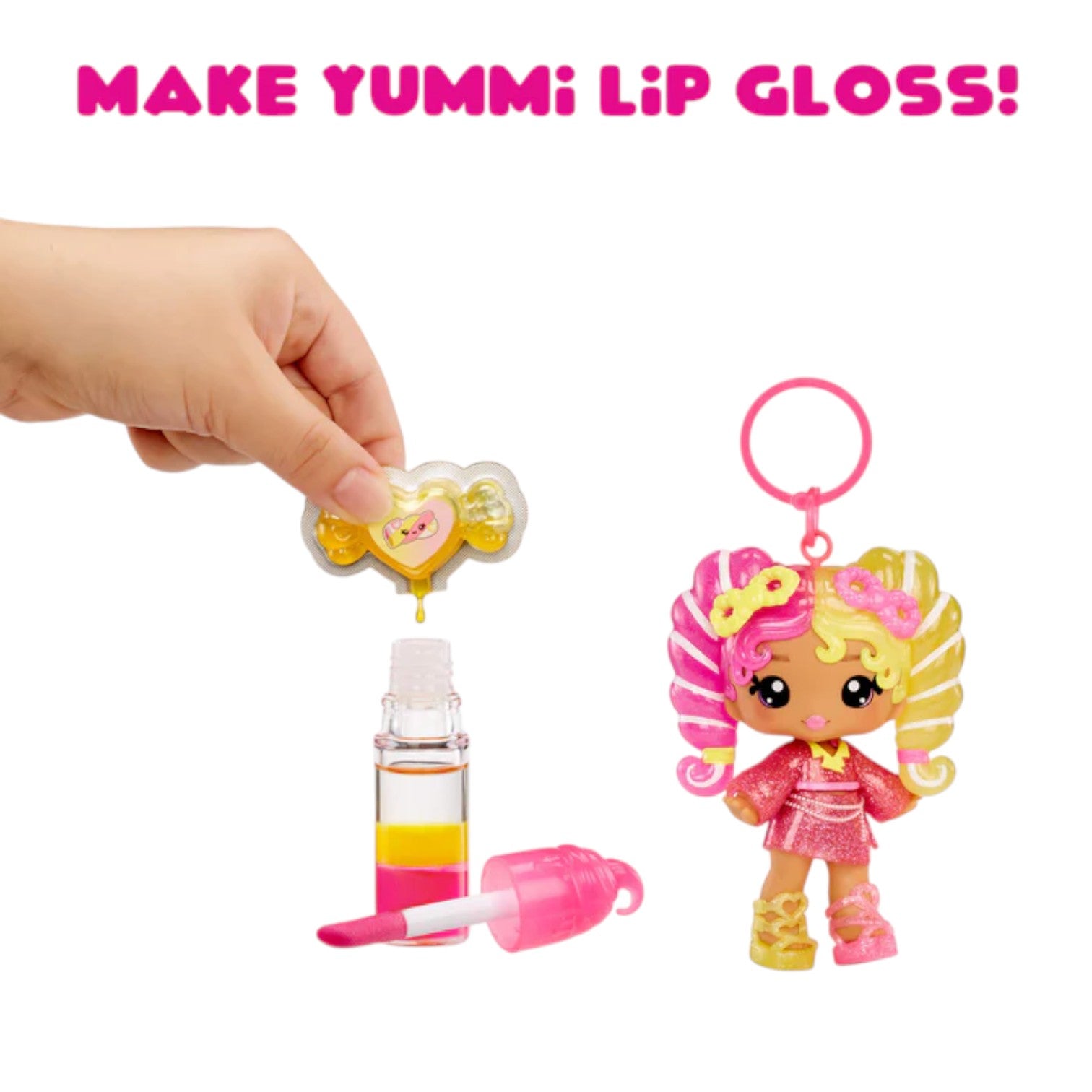 Yummiland Mila Mallows Mystery Color Change Doll – Front View lip gloss set with a character keychain and hand holding the product on a white background.